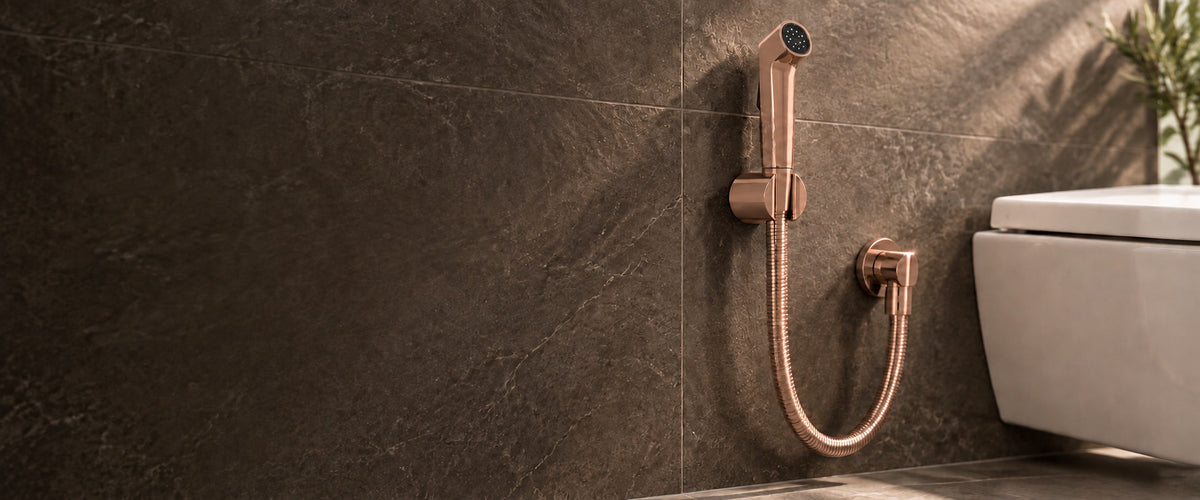 IBEY rose-gold health faucet set installed in a stone bathroom