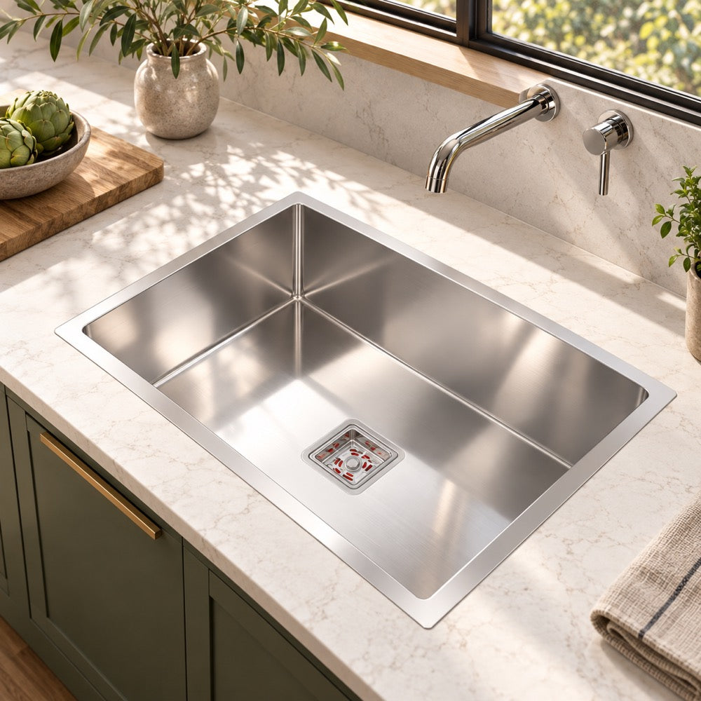 AI-composited lifestyle visual: IBEY single deep bowl 24 x 18 inch kitchen sink in a quartz worktop.