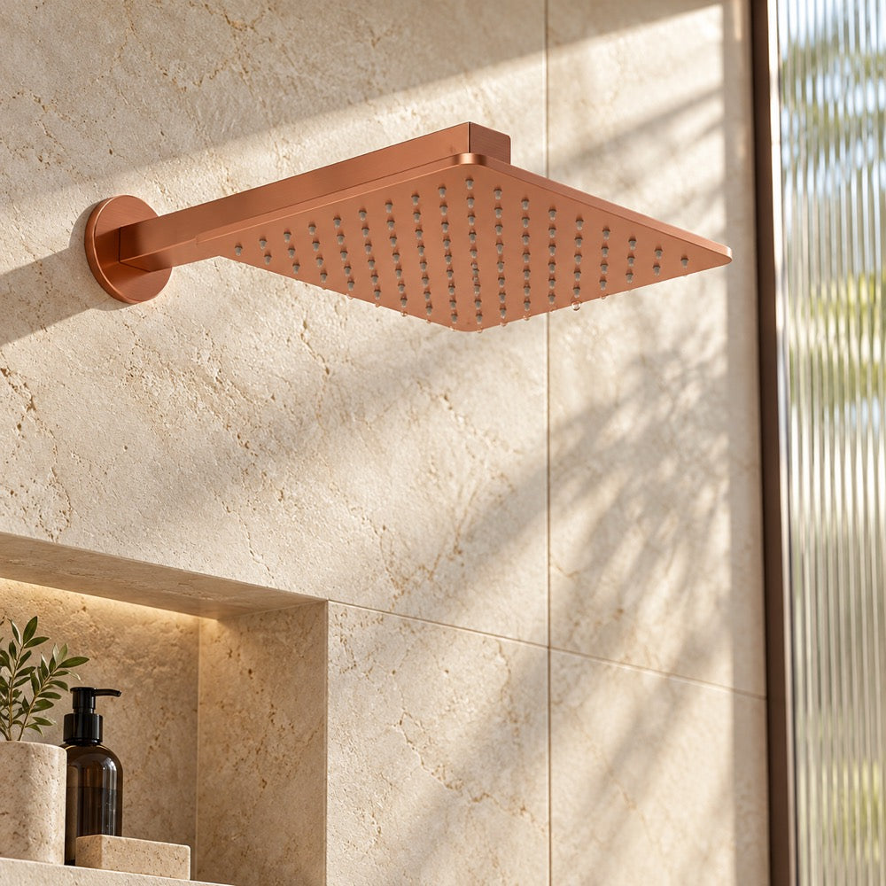 AI-composited lifestyle visual: IBEY Elegant Square Rose Gold shower in a limestone bathroom.